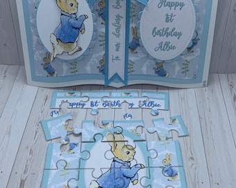 Personalised Peter Rabbit book style card with matching personalised jigsaw. Boxed card. New baby boy. First birthday.