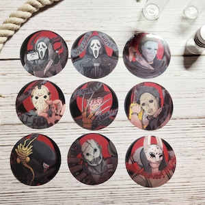 May include: Nine round stickers featuring horror movie characters. Each sticker has a red background with a black and white illustration of a character from a horror movie. The characters include Ghostface, Freddy Krueger, Jason Voorhees, Leatherface, Michael Myers, and more. The stickers are perfect for adding a spooky touch to your laptop, water bottle, or phone.