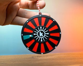 Adorno navideño de The Killers: decoración de ruleta con diamantes rebeldes
