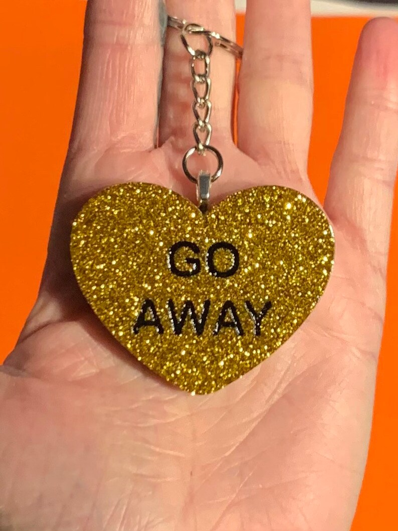 Gold Go Away keychain