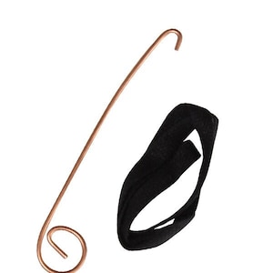 May include: A copper wire hanger with a loop at the top and a spiral at the bottom. A black fabric band is also included.