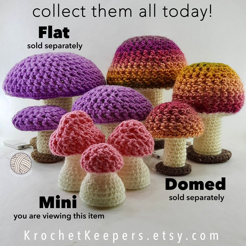 May include: A selection of crocheted mushroom ornaments in different sizes and colours, including purple, pink, and orange. The mushrooms have white stems and brown bases. The image includes the text "collect them all today!" and "KrochetKeepers.etsy.com".