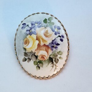 Vintage oval hand painted floral porcelain brooch