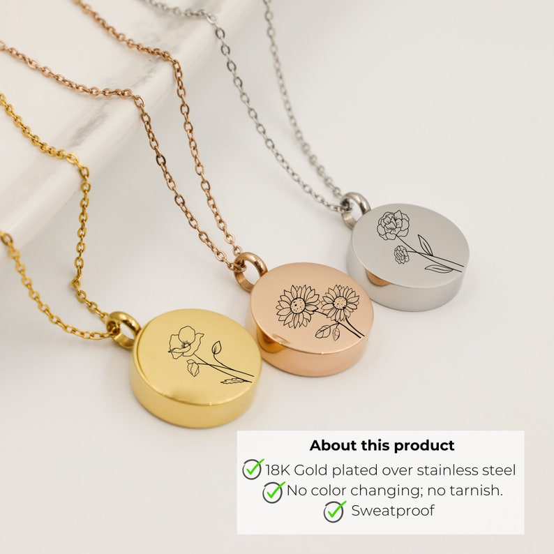 May include: Three gold, rose gold, and silver necklaces with round pendants featuring engraved floral designs. The pendants are engraved with a sunflower, a poppy, and a carnation. The text on the image reads "About this product 18K Gold plated over stainless steel No colour changing; no tarnish. Sweatproof."