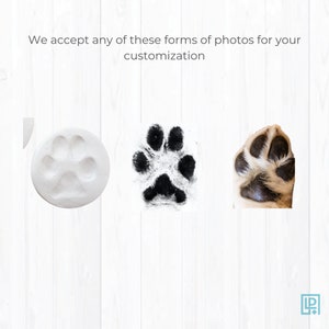 May include: Three different ways to capture your pet's paw print for a custom keepsake. A white clay paw print, a black ink paw print, and a photo of a dog's paw.