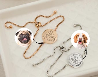 May include: Two personalized dog charm bracelets. The top bracelet is rose gold with a pug charm engraved with "Floppy". The bottom bracelet is silver with a beagle charm engraved with "Mandy".
