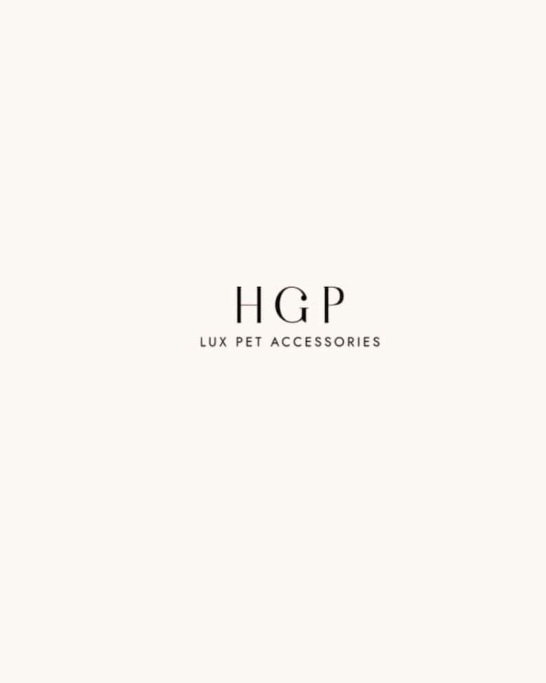 May include: A minimalist logo on a cream background. The logo features the letters "HGP" in a serif font, with "LUX PET ACCESSORIES" written below in a smaller font. The overall design is clean and elegant.