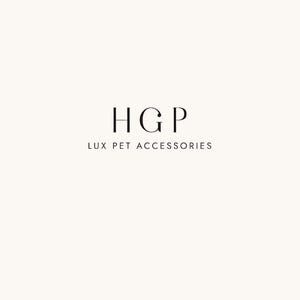 May include: A minimalist logo on a cream background. The logo features the letters "HGP" in a serif font, stacked above the text "LUX PET ACCESSORIES" in a smaller, sans-serif font. The design is clean and elegant.