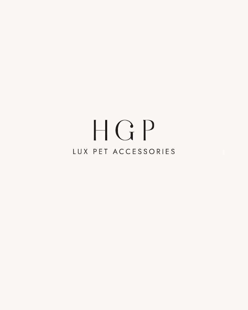 May include: A minimalist logo on a cream background. The logo features the letters "HGP" in a serif font, stacked above the text "LUX PET ACCESSORIES" in a smaller, sans-serif font. The design is clean and elegant.