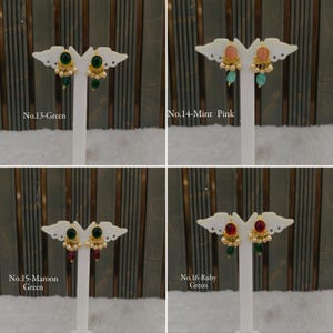 May include: Four pairs of gold-tone earrings displayed on white stands. No. 13-Green features dark green stones, No. 14-Mint Pink has pink and mint stones, No. 15-Maroon Green has maroon and green stones, and No. 16-Ruby Green has ruby and green stones.