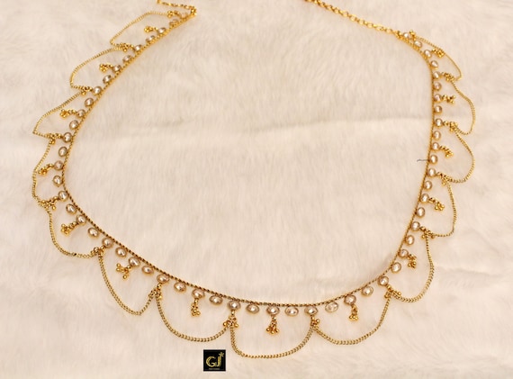 Gold saree chain best sale designs