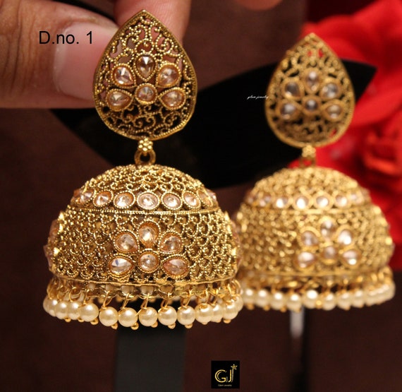 gold big jhumka earrings