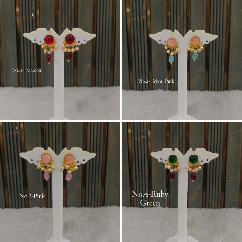 May include: Four pairs of drop earrings displayed on white stands. No. 1 features maroon stones, No. 2 has mint and pink stones, No. 3 displays pink stones, and No. 4 shows ruby and green stones. Each earring includes gold-tone metal and small pearls.