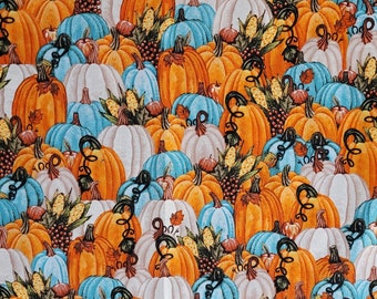 Tela con estampado de calabazas y algodón otoñal.