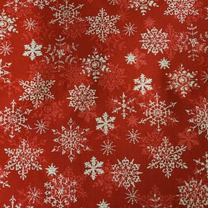 Roter Weihnachtsschneeflocken-Stoff Meterware