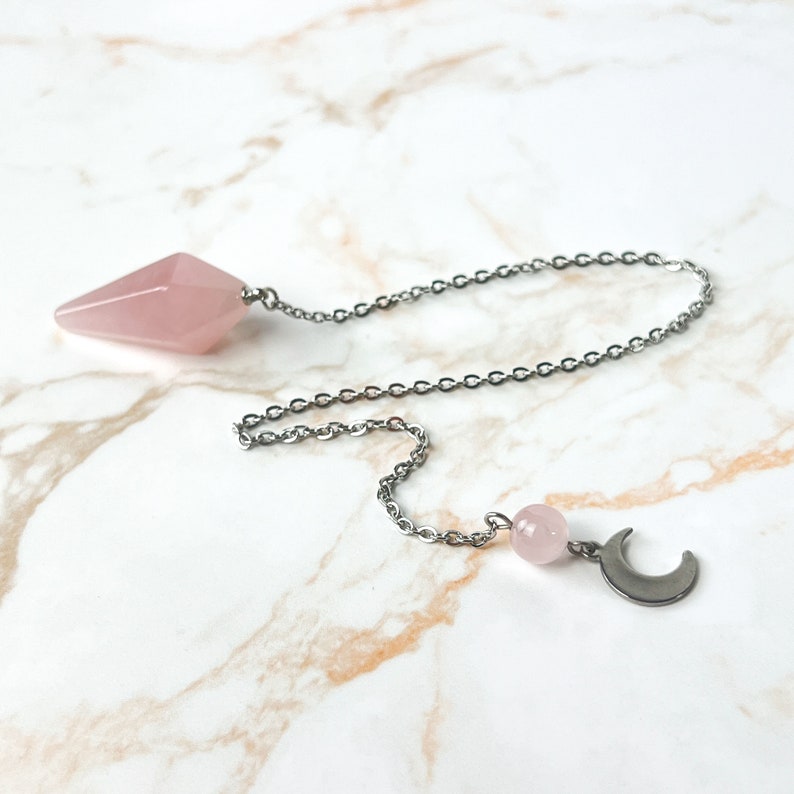 Rose quartz gemstone dowsing pendulum crescent moon and stainless steel witch divination tool