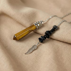 Gemstone pendulum, tiger eye gemstone, raw obsidian beads, with a feather charm