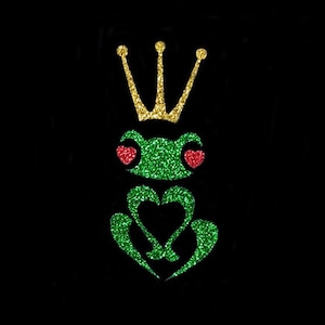 May include: A green glitter frog wearing a gold glitter crown with red glitter hearts for eyes.