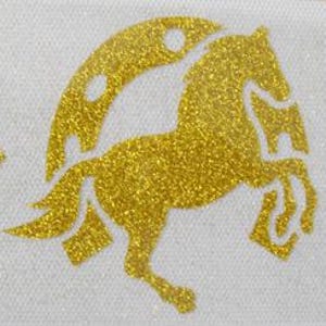 May include: A gold glitter horse graphic with a crescent moon design on a white background. The horse is rearing up on its hind legs. The image is a close-up of the design.