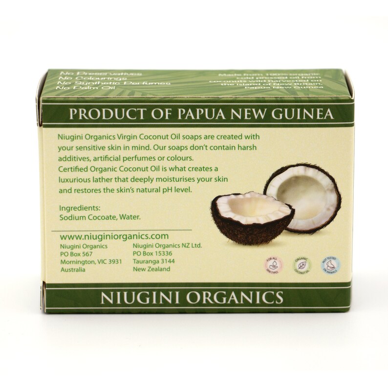 May include: A bar of Niugini Organics Virgin Coconut Oil soap, made in Papua New Guinea. The soap is packaged in a white box with green text and a picture of a coconut. The box lists the ingredients as Sodium Cocoate and Water. The box also lists the company's website, www.niuginiorganics.com, and contact information for both the Australian and New Zealand locations.