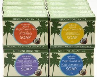 May include: A stack of 10 bars of organic soap made with virgin coconut oil. The soap bars are packaged in boxes with green palm tree designs and feature different essential oils: Patchouli, Lemongrass, Lavender, and Pure Unscented. Each bar is 100g.