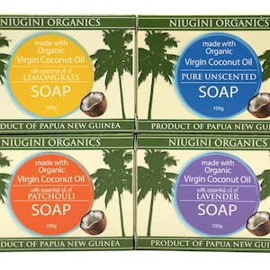 May include: Four bars of organic soap made with virgin coconut oil. The soaps are packaged in boxes with green, orange, purple, and white backgrounds. The boxes feature images of palm trees and coconuts. The soap scents are lemongrass, patchouli, lavender, and unscented.