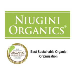 May include: A green and gold logo for Niugini Organics, a company that has won the 2017 Organic Consumer Choice Award for Best Sustainable Organic Organisation. The logo features the company name in white text and a gold seal with the award details.