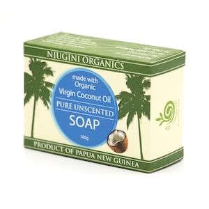 May include: A bar of pure unscented soap made with organic virgin coconut oil. The soap is packaged in a box with a green and white design featuring palm trees and a coconut. The box also includes the text "Niugini Organics" and "Product of Papua New Guinea".