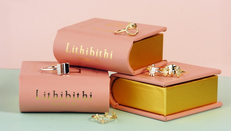 a couple of pink boxes sitting on top of a table