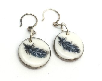 Round white porcelain earrings, handpaint black feathers silver