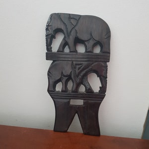 Vintage carved azure wooden picture with elephants.