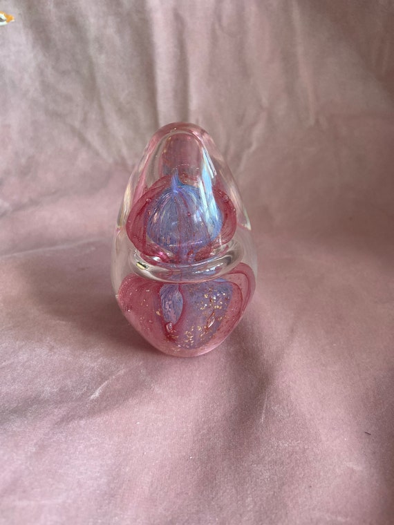 Beautiful vintage paperweight. Glass oval  whit looks like pink jellyfish inside.
