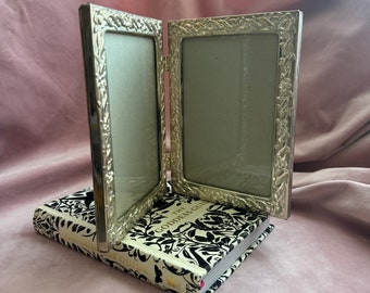 Vintage Beautiful silver plate double picture frame.Silver glovers.