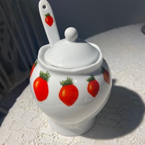Beautiful hand painted jam bowl with lid.  Sugar bowl with porcelain spoon.