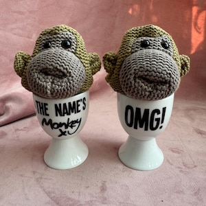Vintage set of 2 Egg Cups and  egg Coseys,Most Famous Monkey.