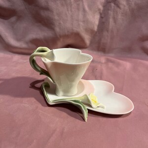 Beautiful porcelain cup,saucer hart shape and lilie .Fine Porcelain