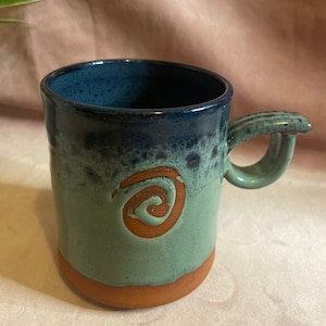 Stoneware mug green and navy colours.