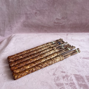 Vintage Asian  wooden  set of 6 sticks and case.