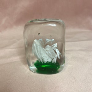 Beautiful paperweight rectangular shape crystal glass whit green and white in side.Bauble inside.