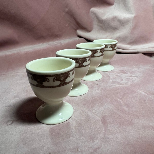 Vintage set of 4 Clay Egg Cups.Light cups with brown ornaments.