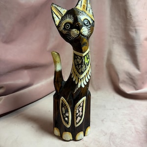 Unique wooden cats with mirror decoration.
