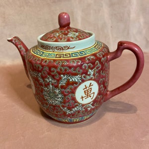 Very pretty vintage Japanese Ceremonial Porcelain Teapot.Hand painted Japanese scene.