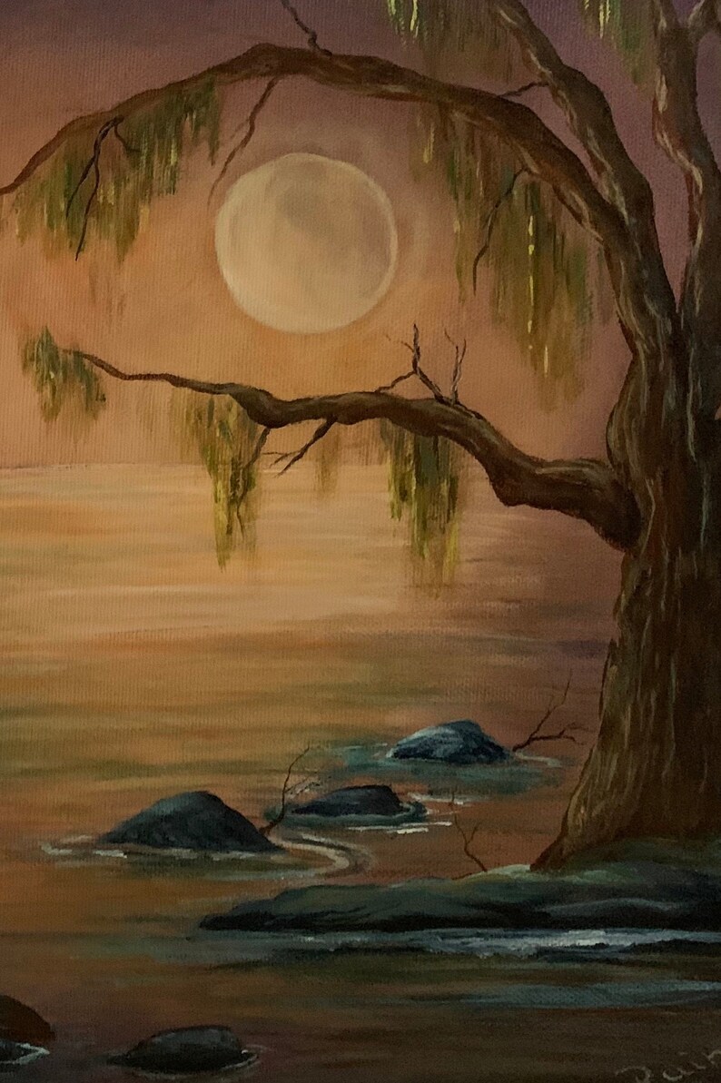 May include: A painting of a large tree with long, green branches hanging down over a body of water. The moon is visible in the sky behind the tree. The water is a light brown color and there are several rocks in the water.