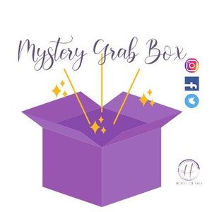 May include: A purple box with a lid open, revealing a sparkling light inside. The text "Mystery Grab Box" is above the box. The box is labeled "House of Dana".