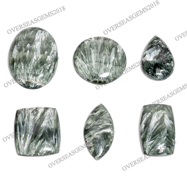 May include: Six green and silver gemstone cabochons in various shapes, including round, oval, pear, and rectangular. The gemstones have a shimmering, iridescent effect.