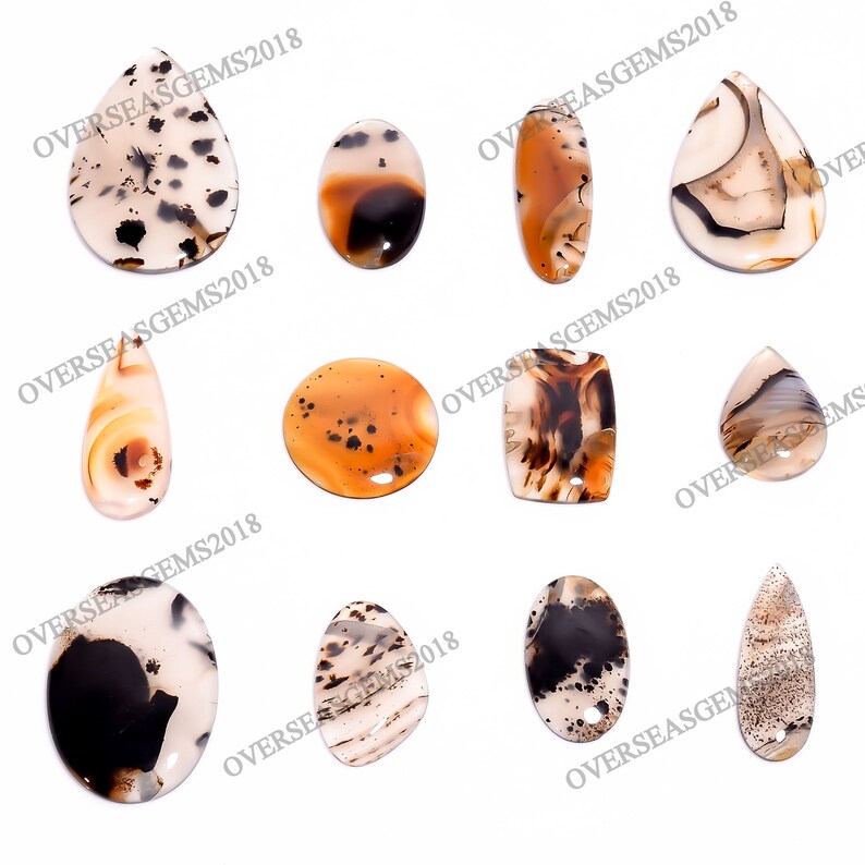 May include: Assortment of ten agate gemstone pendants in various shapes and sizes. The pendants are in shades of brown, white, and black with intricate patterns.