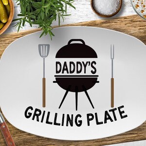 a white plate with a grilling plate on it