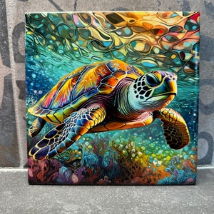 May include: A vibrant square canvas print featuring a colorful sea turtle swimming underwater. The turtle has a detailed shell with shades of orange, yellow, blue, and green. The background depicts coral and bubbles, creating a lively ocean scene.