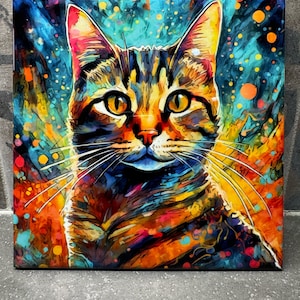 May include: A colorful abstract painting of a tabby cat with a blue, orange, yellow, and green background. The cat's fur is painted in a variety of colors, including brown, black, and white. The cat's eyes are large and green.