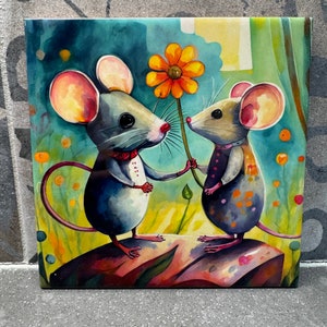 May include: Two cartoon mice, one gray and one purple, stand on a rock with a yellow flower between them. The gray mouse is holding the flower stem and the purple mouse is holding the flower.